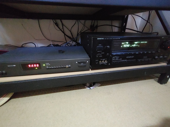 The external radio tuner powered on next to the AV receiver.